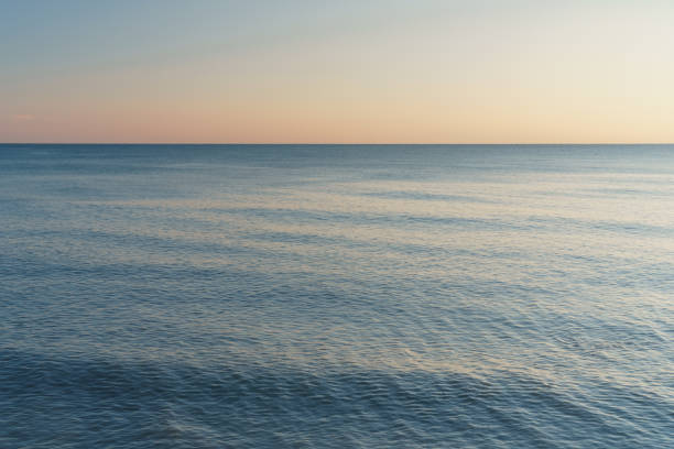 istock Horizontal line between sea and sky at sunset. 1430386676