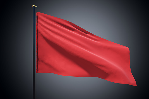 Blank red flag waving in the wind with copyspace for your logo or text isolated on dark grey background. 3D rendering, mockup