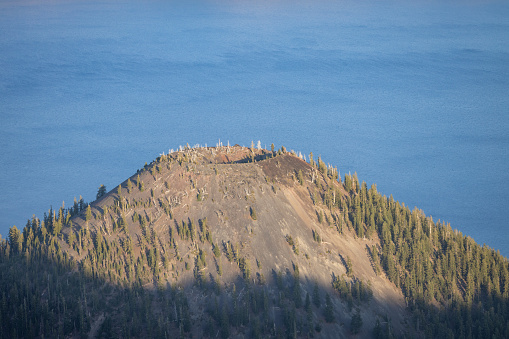 Wizard Island volcanic cone in Crater Lake National Park at golden hour.