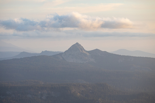 View of Union Peak from the rim of Crater Lake in Crater Lake National Park during golden hour.