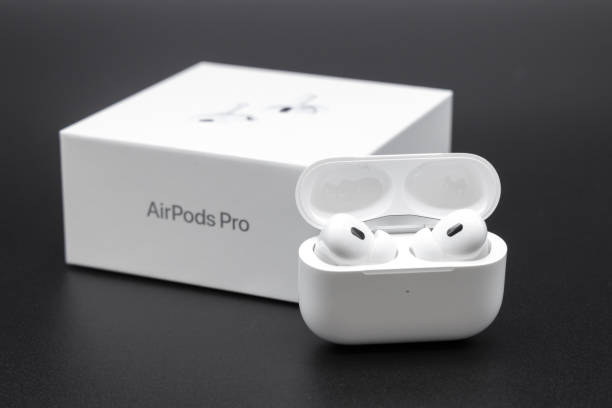 Apple AirPods Pro 2nd generation inside case next to packaging box stock photo