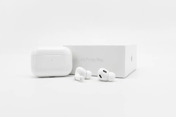 Apple AirPods Pro 2nd generation next to case and packaging box stock photo