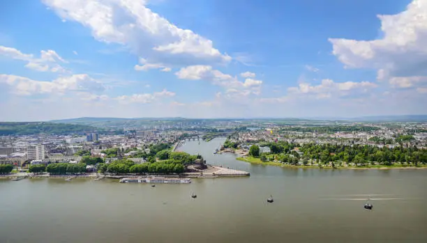 Aerial panoramic View at Koblenz city with monument at Deutsches Eck where the Mosel river joins the Rhine. Travel destination for a weekend getaway in Germany and cable car as tourist attraction.