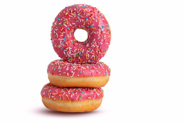 istock Stack of glazed donuts with pink icing. Isolated on white background. Copy space 1430392322