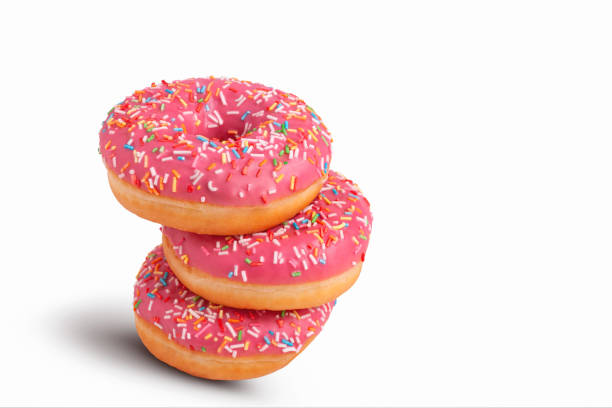 istock Stack of glazed donuts with pink icing. Isolated on white background. 1430392369