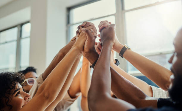 Support, teamwork and hands of business people for community for collaboration, growth and goals. Diversity, vision and trust with employees in networking, innovation and success mindset workshop