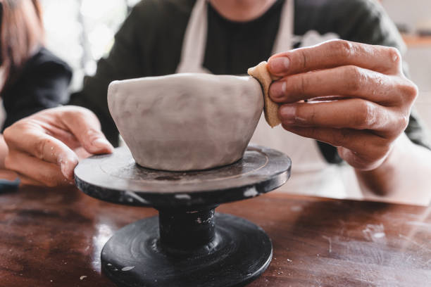 istock View of male hands works with clay makes future ceramic plate, ceramic artist makes classes of hand building in modern pottery workshop, creative people handcrafted design 1430398898