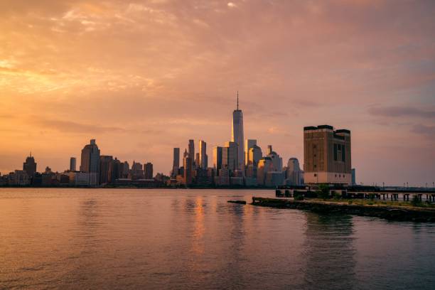 istock Panoramic New York City skyline at sunrise river 1430399393