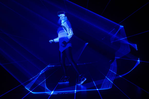 istock Woman is using virtual reality headset to access in metaverse. 1430400808