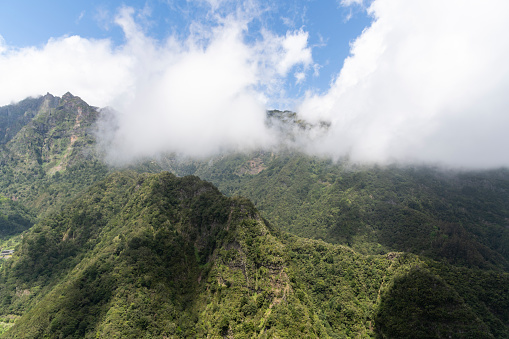 Theview over the beautiful green mountains from Levada dos Balcoes, Madeira. Beautiful sunny day for hike.