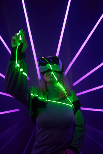 istock Woman is using virtual reality headset to access in metaverse. 1430402427