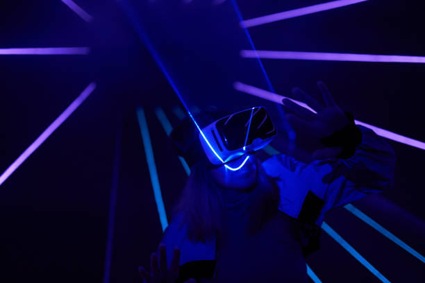istock Woman is using virtual reality headset to access in metaverse. 1430403560