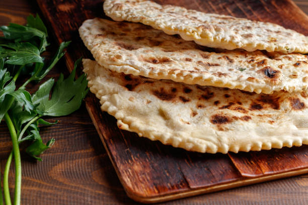 istock Delicious gourmet flat bread kutabs with herbs and cheese on a plate 1430404479