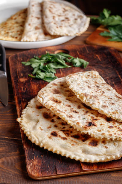 istock Delicious gourmet flat bread kutabs with herbs and cheese on a plate 1430404492