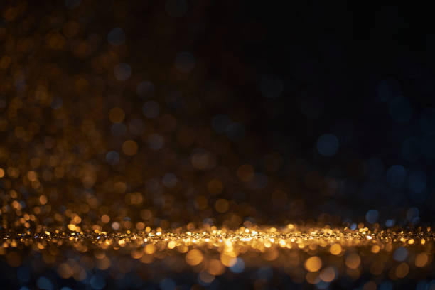 Shiny gold and blue defocused lights holiday bokeh background stock photo