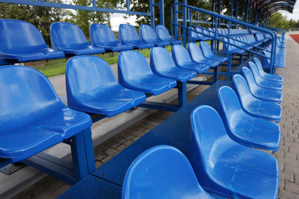 istock Rows of blue plastic seats on a stadium tribune 1430410621
