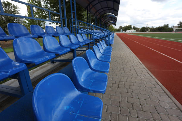 istock Rows of blue plastic seats on a stadium tribune 1430410630