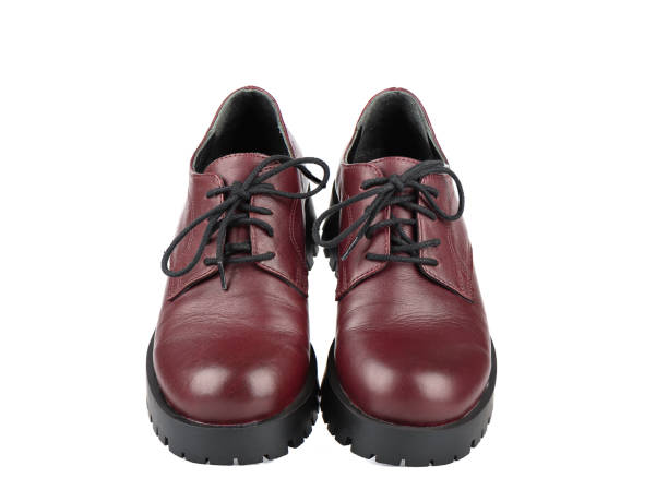 istock Women's brogue boots with tied laces on a white background. 1430412478