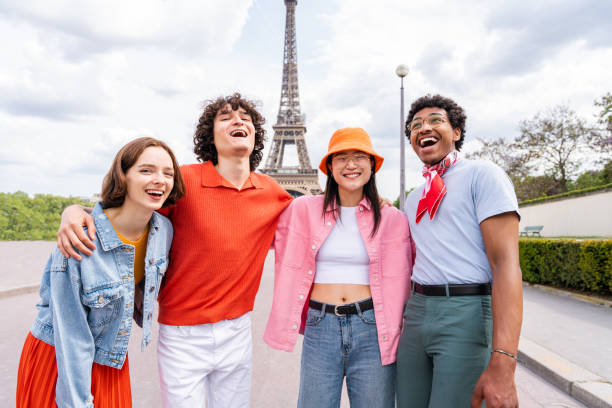 istock Group of young happy friends visiting Paris and Eiffel Tower 1430413635