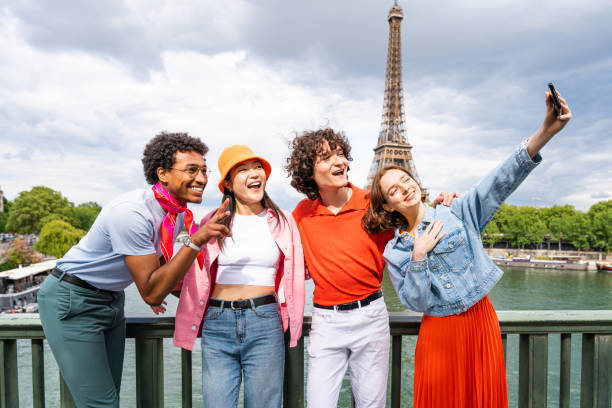 istock Group of young happy friends visiting Paris and Eiffel Tower 1430413712