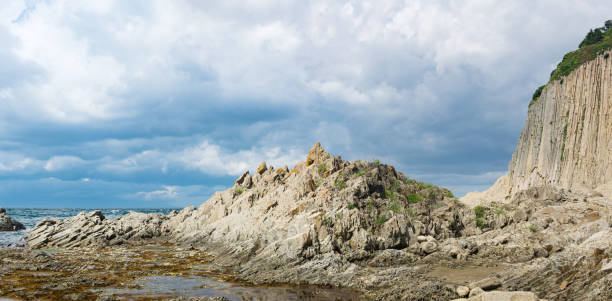 istock ocean shore with rocks of columnar basalt, Cape Stolbchaty on Kunashir Island 1430413780