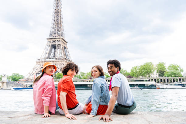 istock Group of young happy friends visiting Paris and Eiffel Tower 1430413807