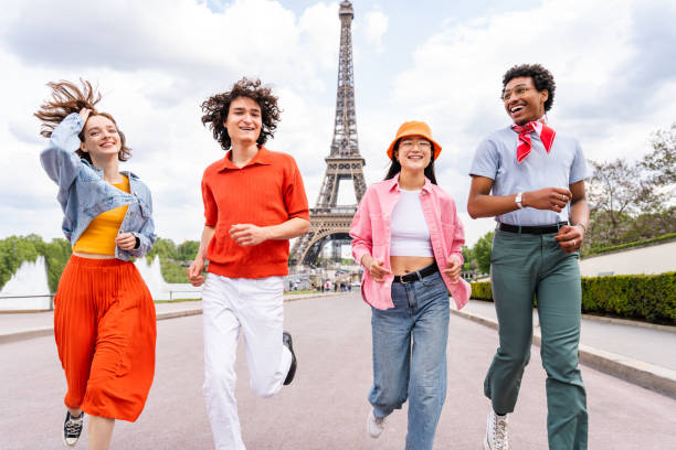 istock Group of young happy friends visiting Paris and Eiffel Tower 1430413879