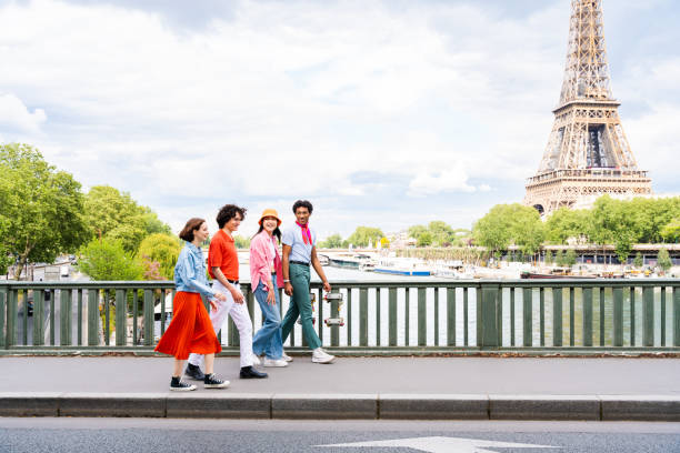 istock Group of young happy friends visiting Paris and Eiffel Tower 1430414143