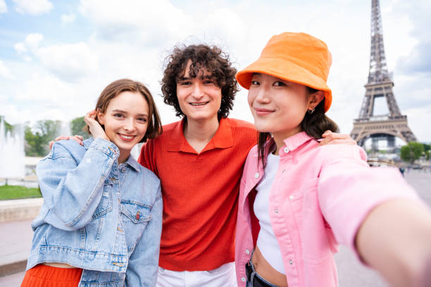 istock Group of young happy friends visiting Paris and Eiffel Tower 1430414540