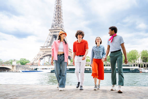 istock Group of young happy friends visiting Paris and Eiffel Tower 1430414610