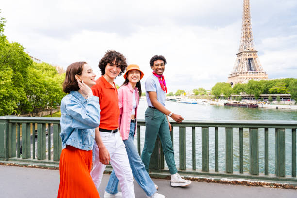 istock Group of young happy friends visiting Paris and Eiffel Tower 1430414739