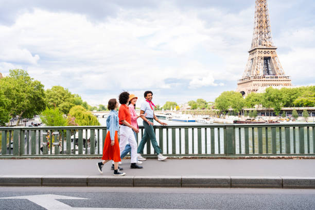 istock Group of young happy friends visiting Paris and Eiffel Tower 1430414972