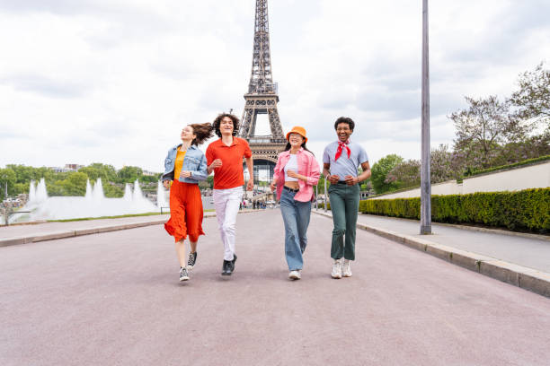 istock Group of young happy friends visiting Paris and Eiffel Tower 1430415679