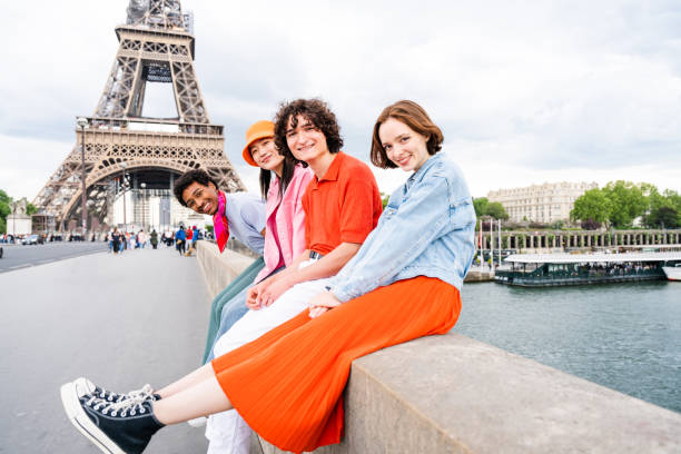 istock Group of young happy friends visiting Paris and Eiffel Tower 1430416258