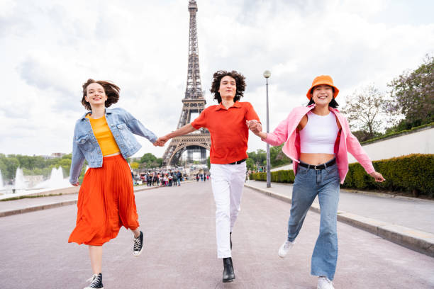 istock Group of young happy friends visiting Paris and Eiffel Tower 1430416390