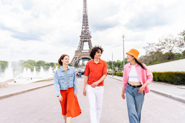 istock Group of young happy friends visiting Paris and Eiffel Tower 1430416474