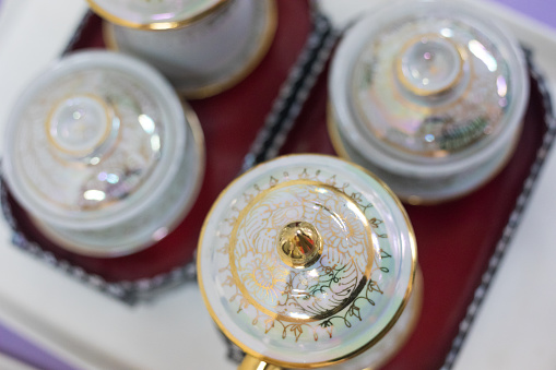 Top view onto Thai buddhist tea pots at temple