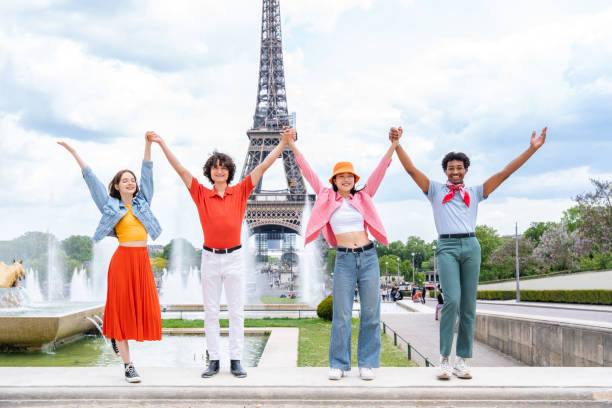 istock Group of young happy friends visiting Paris and Eiffel Tower 1430416577