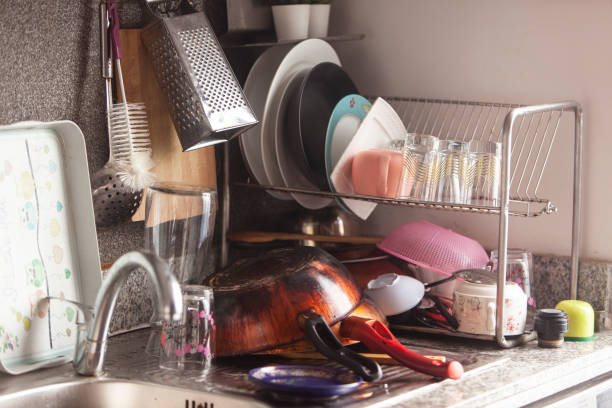 istock Stack of used frying dishes, Sink full of washed  kitchenware 1430416651
