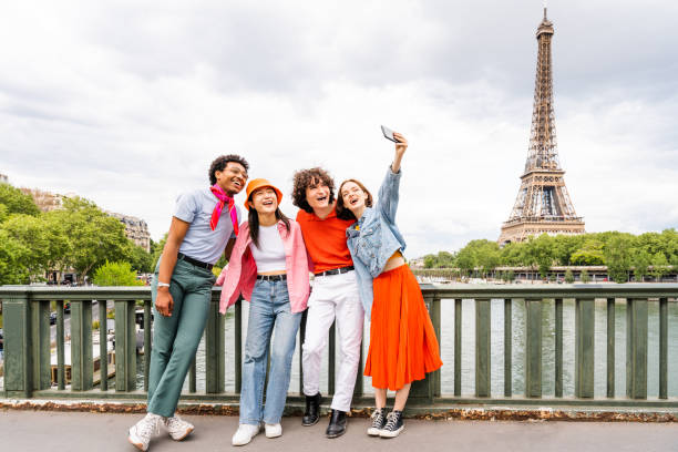 istock Group of young happy friends visiting Paris and Eiffel Tower 1430416719