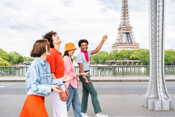 istock Group of young happy friends visiting Paris and Eiffel Tower 1430416829