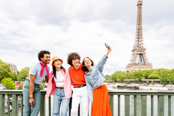 istock Group of young happy friends visiting Paris and Eiffel Tower 1430417862