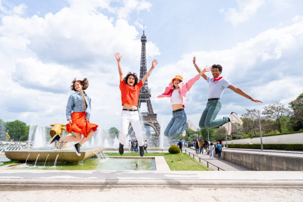 istock Group of young happy friends visiting Paris and Eiffel Tower 1430418087