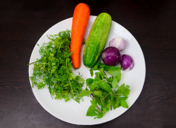 istock Cucumber, Carrots, Coriander, Mint Leaves, and Onions 1430418949