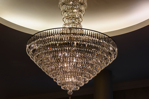 Chandelier hangs in the lobby of a hotel