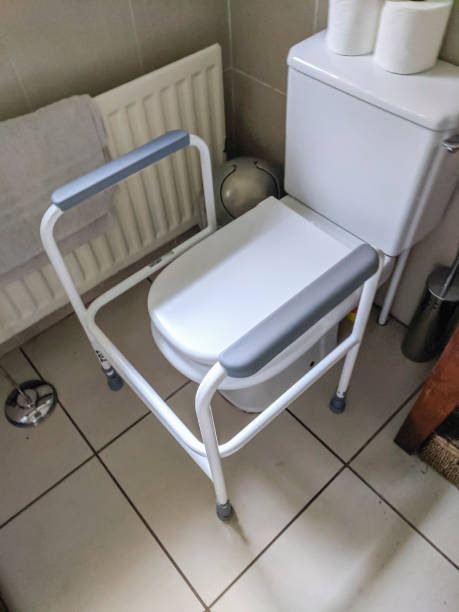istock Support frame and handles to help a disabled person use a toilet. 1430420937