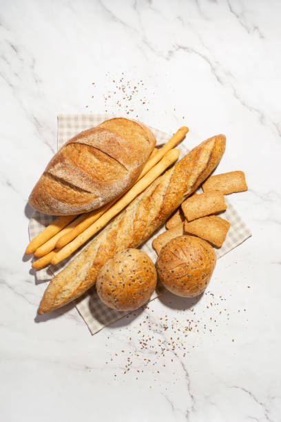 istock Background with different types of fresh bread. Bakery products. Cooking. 1430422814
