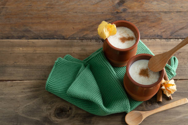 istock Bowls of rice pudding and cinnamon on a wooden background. Copy space. 1430423736