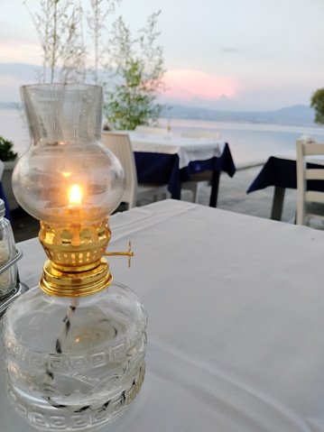 Night gas lamp decoration on a dinner table in Agia Triada near Thessaloniki city