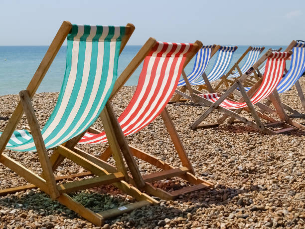 istock Folding deck chairs striped red and green with white stripes 1430426694